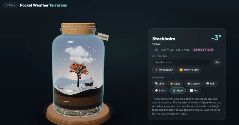 A snowy December noon in the jar, with snow on the cabin roof and the tree gone autumn-red.